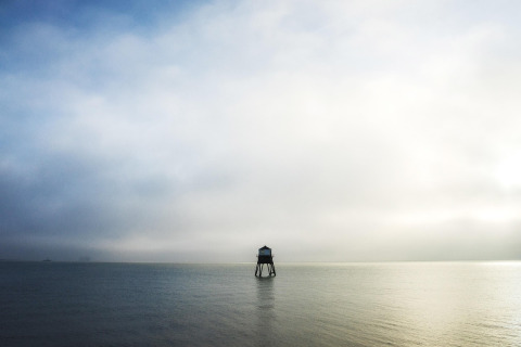 lighthouse calm ocean